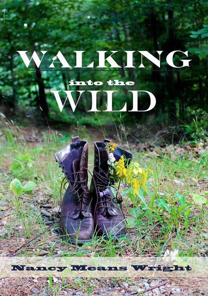 Cover of Walking into the Wild by Nancy Means Wright — a worn pair of laced leather boots standing in long grass at the edge of a green wood, wildflowers tucked into one